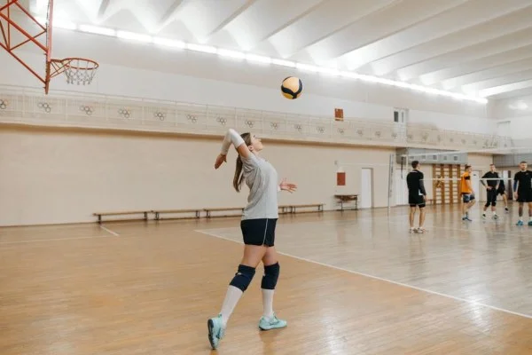female volleyball player serving